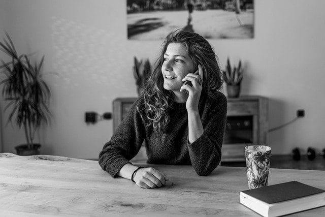 Person sitting at a table-aboutbreakfreefromdebtnow